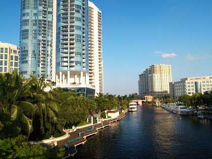 High-rise buildings overlooking a canal with boats in Fort Lauderdale.