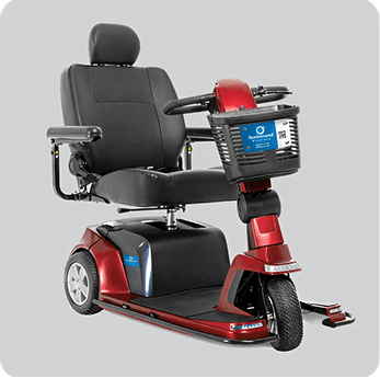 Red three-wheel mobility scooter with a black seat and front basket on a gray background.